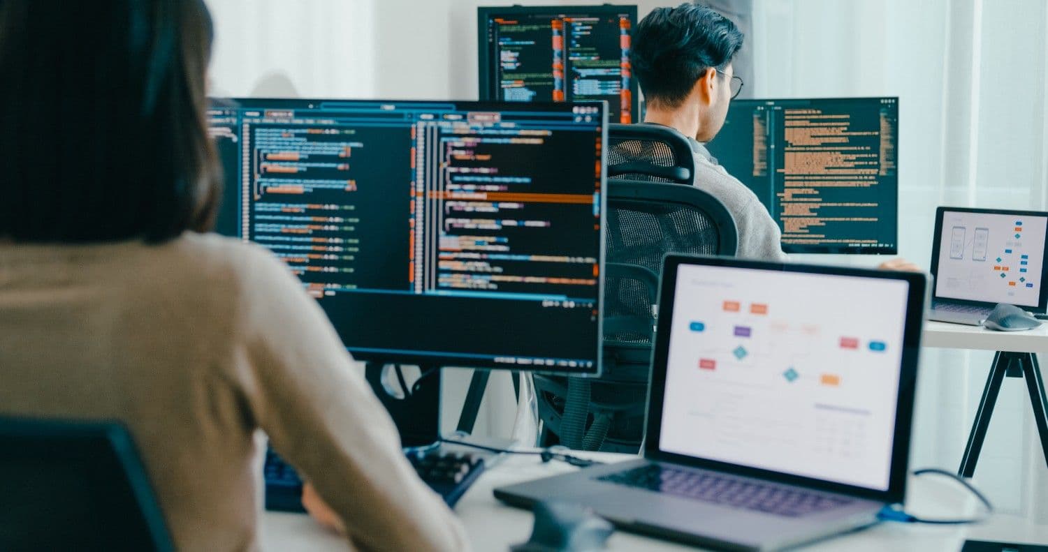Multiple people against screens