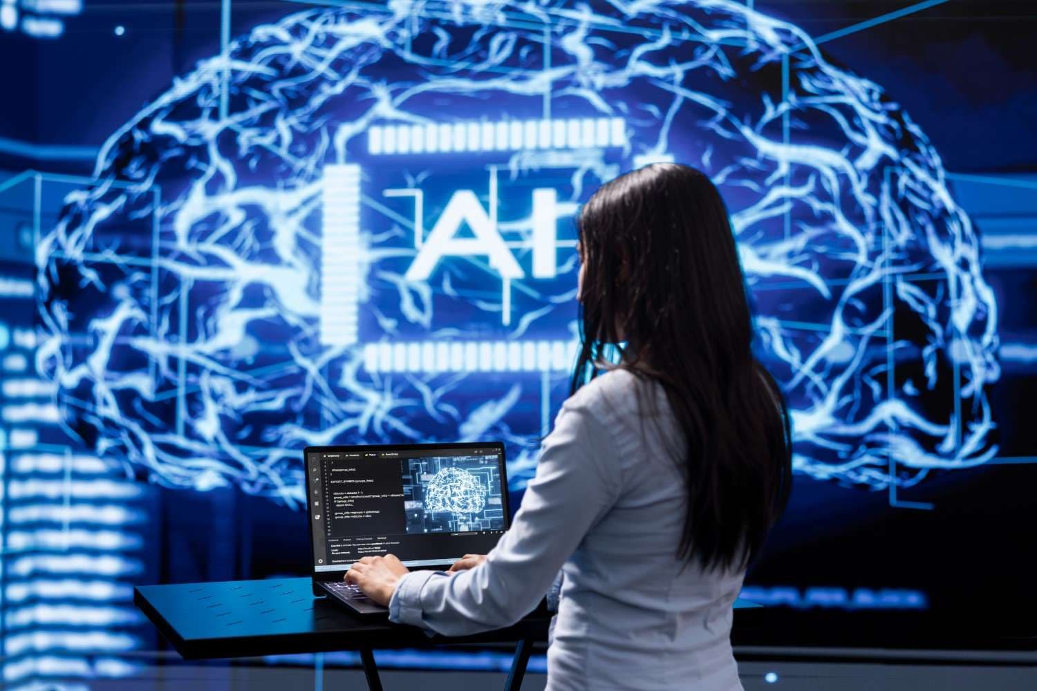 Person using laptop against AI backdrop