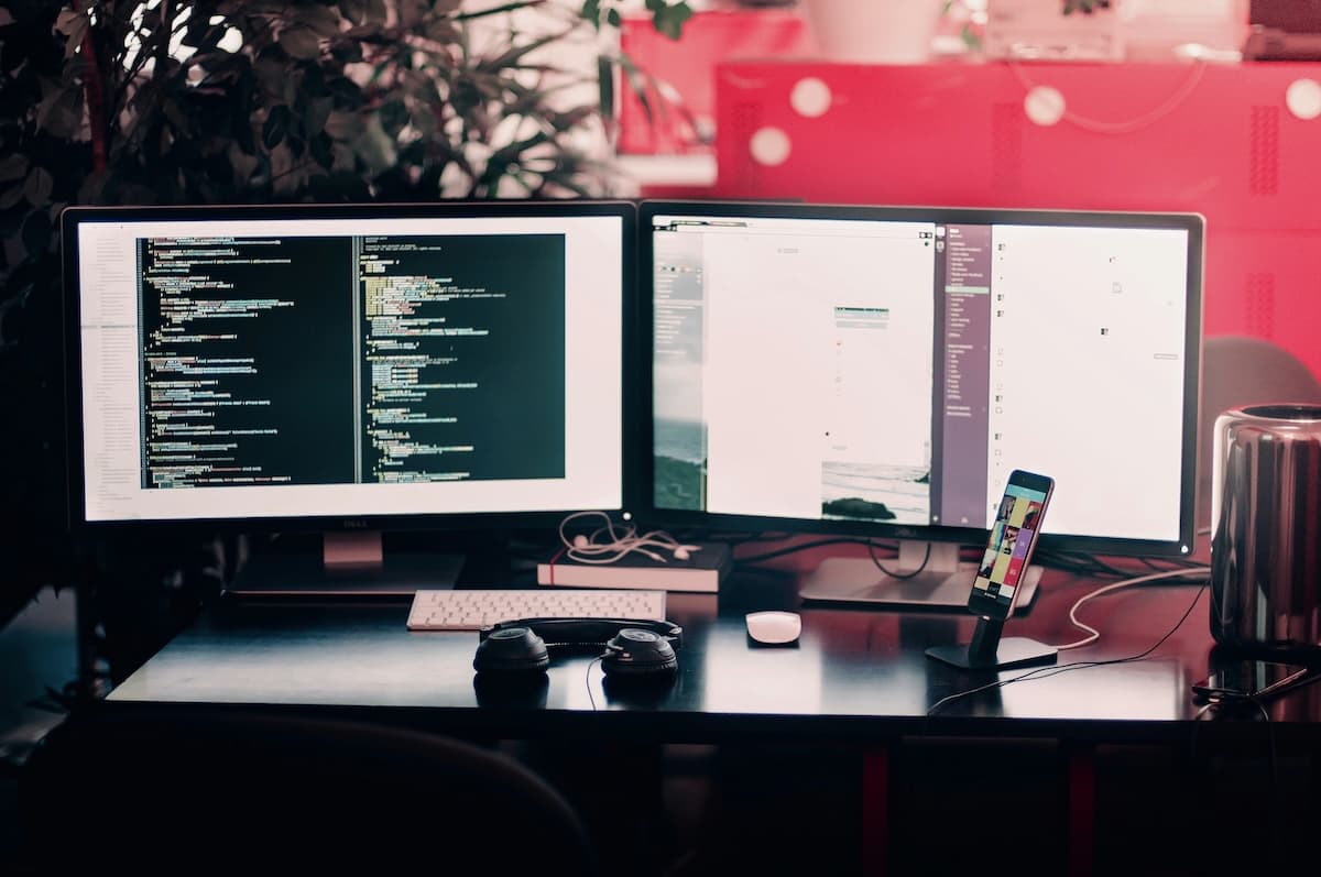 Two monitors and headphones